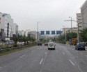 A wide road goes from the port of Piraeus to Athens
